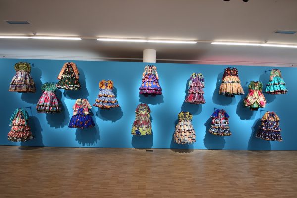 Wall of Victorian costumes executed in Vlisco fabrics